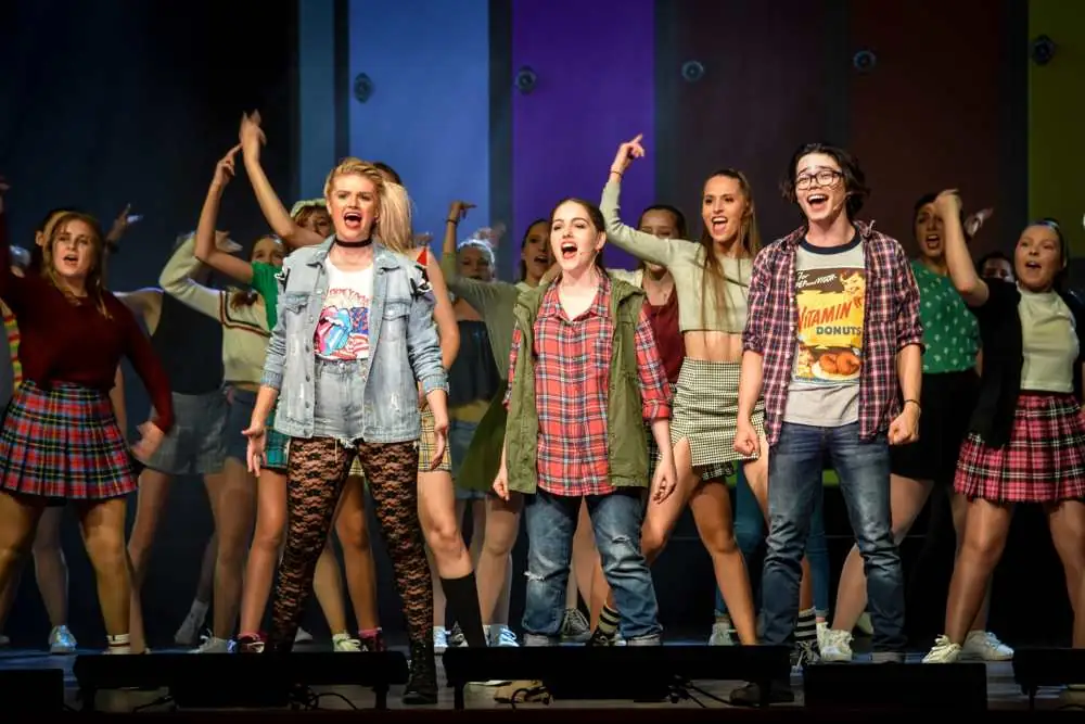 A high school ensemble in plaid and denim