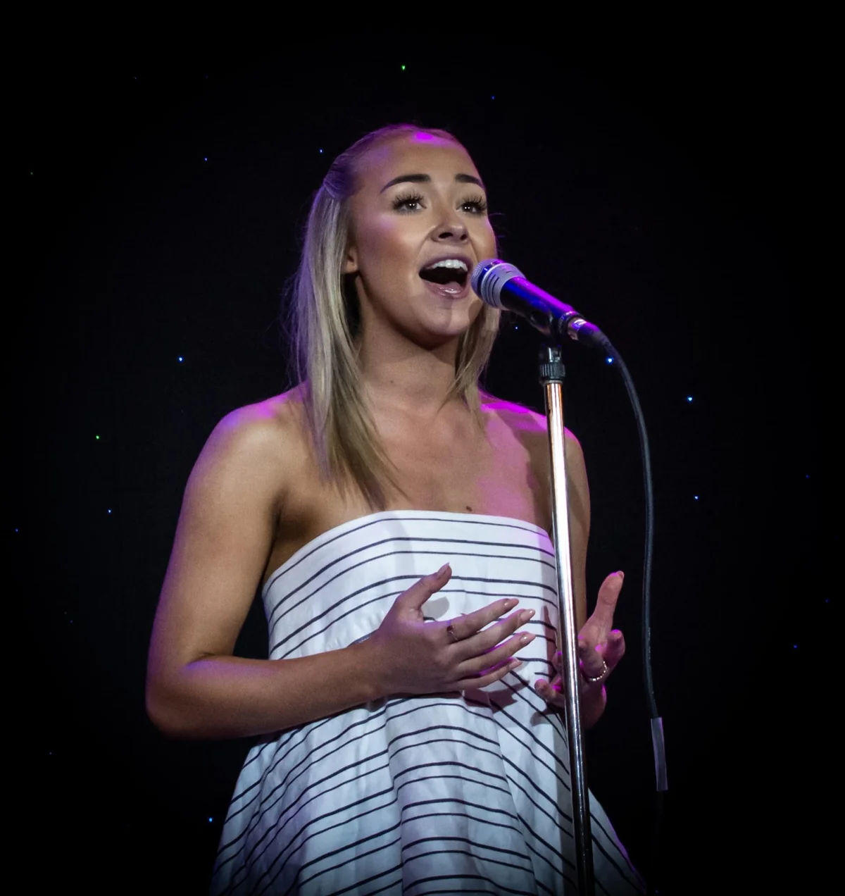 A Pelican singer performing at the microphone